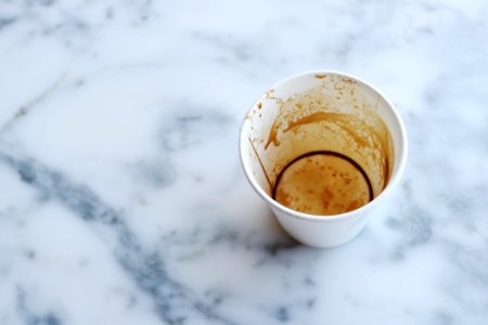 White Paper Cup On Top Of Gray Marble Surface photo