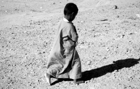 Photographed Grayscale Of Child In Dress photo