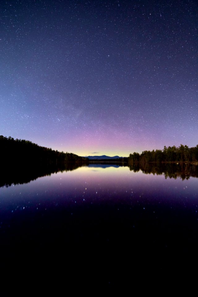 Blue Sea Under The Clear Sky During Night Time