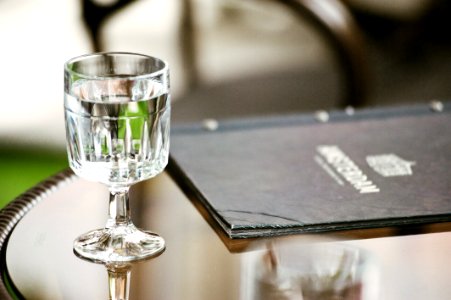 Clear Short-stemmed Glass Beside Menu