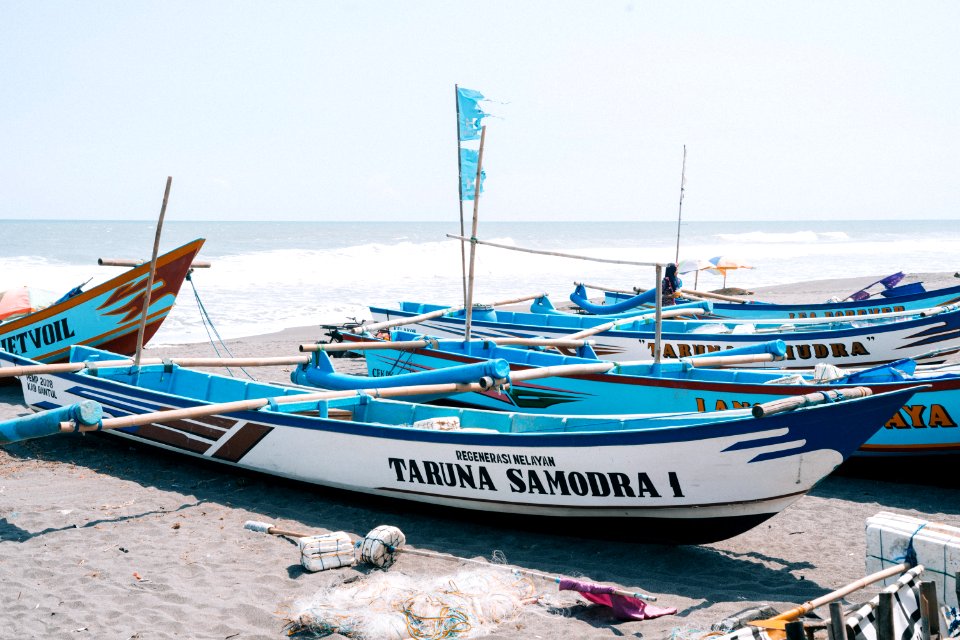 Photo Of Boats Near Seashore