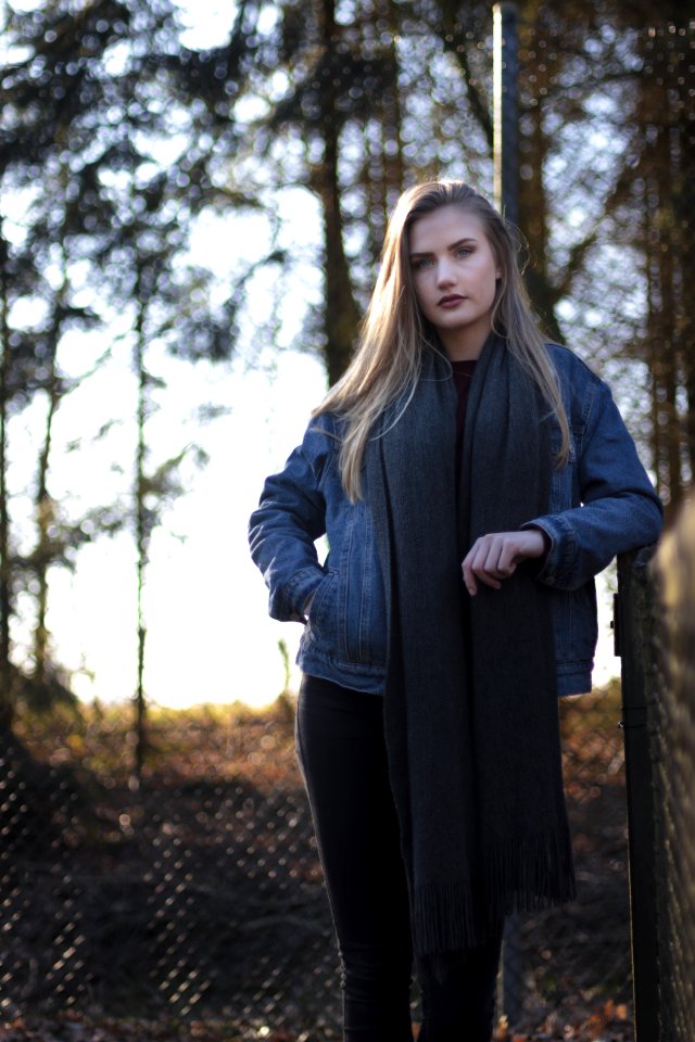Woman In Blue Denim Jacket Standing