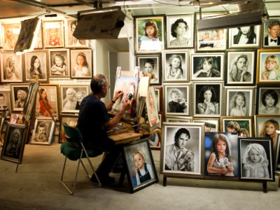 Man Sitting On Chair Painting Inside Room photo