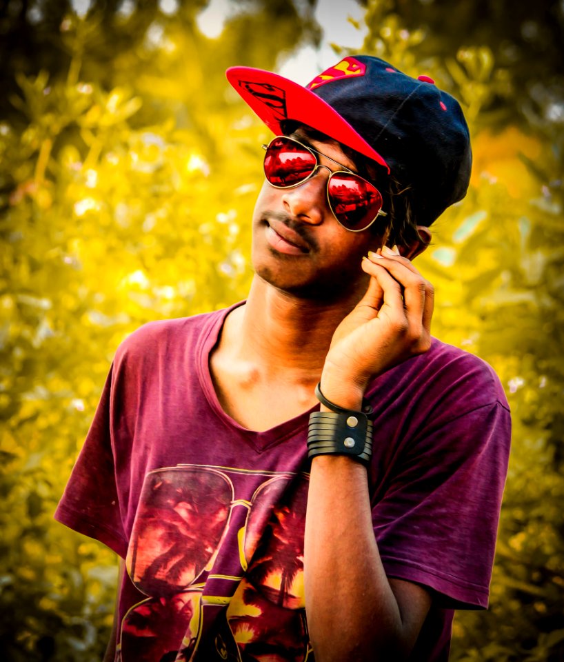 Man Wearing Red And Black Fitted Cap And Purple Crew-neck T-shirt Photo