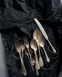 Photo Of Stainless Steel Cutlery On Black Cloth photo