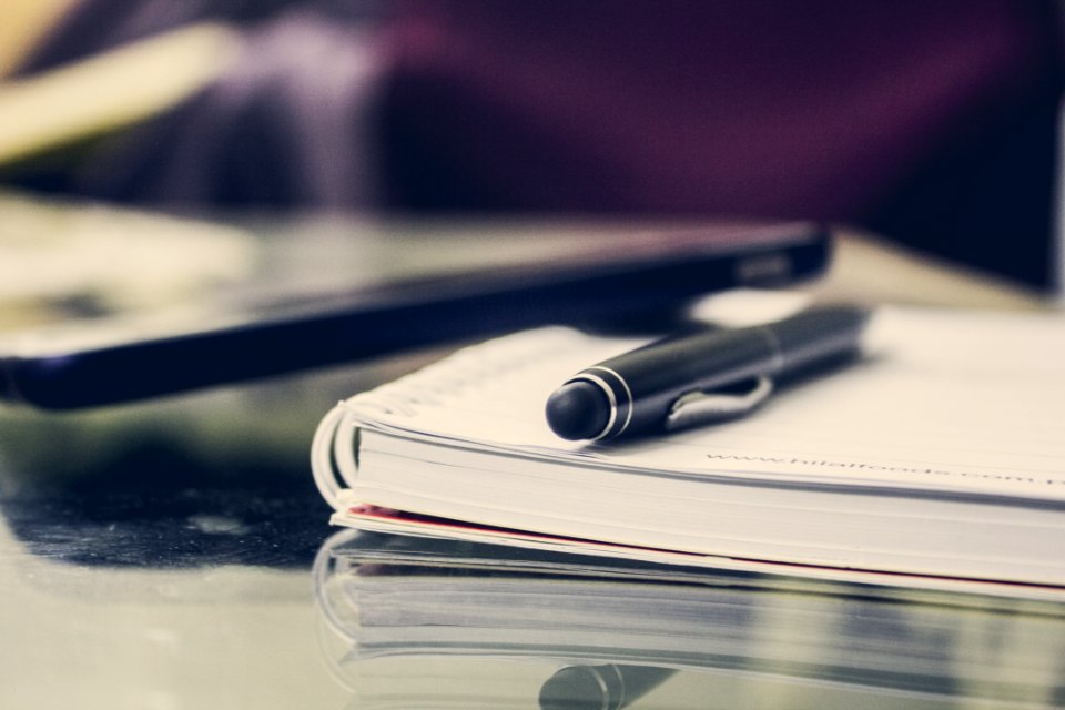Black Twist Pen On Notebook