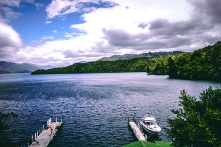 White Yacht Floating Near Dock photo