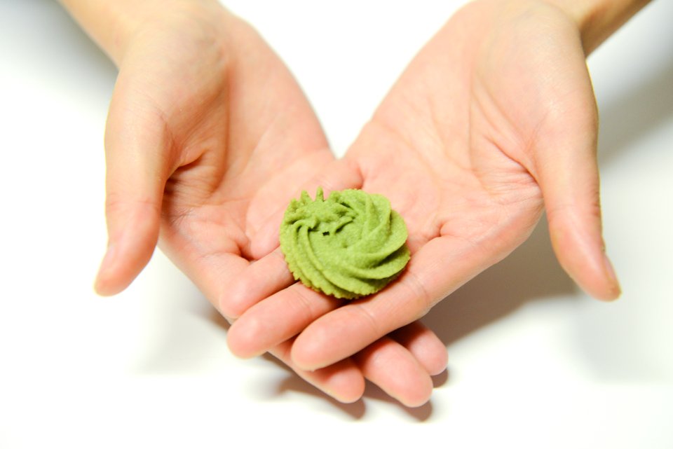Close-Up Photography Of A Person Holding Icing