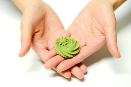 Close-Up Photography Of A Person Holding Icing photo