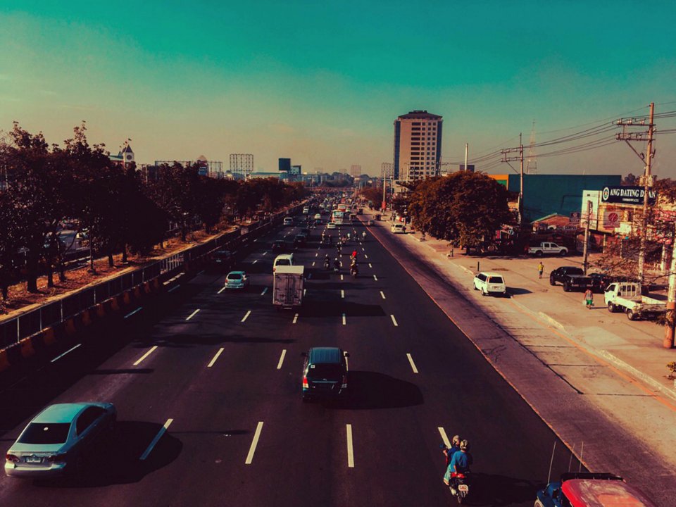 Cars In Black Concrete Road In Landscape Photography