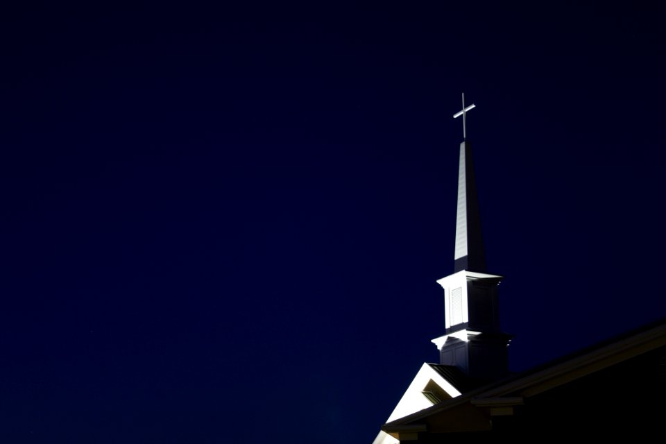 Low Angle View Of Cross Against Sky At Night