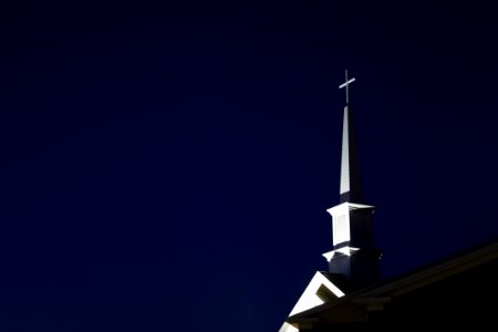 Low Angle View Of Cross Against Sky At Night photo