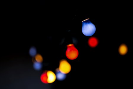 Colored Light Bulbs On Black