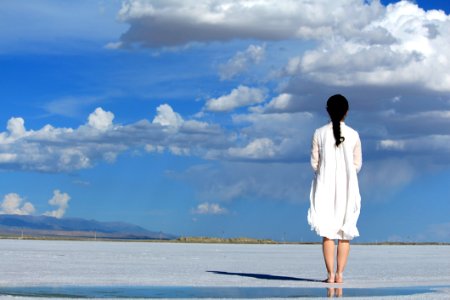 Woman With Umbrella On Beach