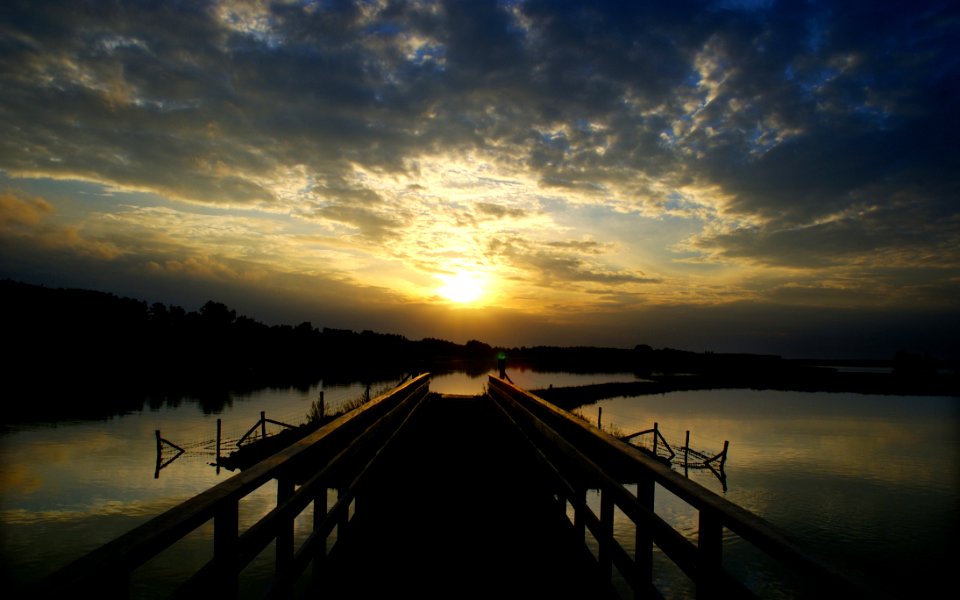 Pontoon Over Lake At Sunset