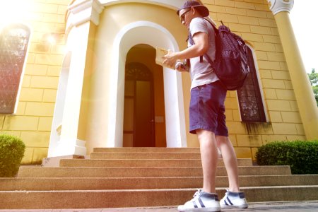 Backpacker Looking At Guidebook photo