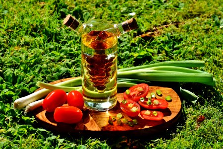 Green Onion Spring Near Clear Glass Container photo