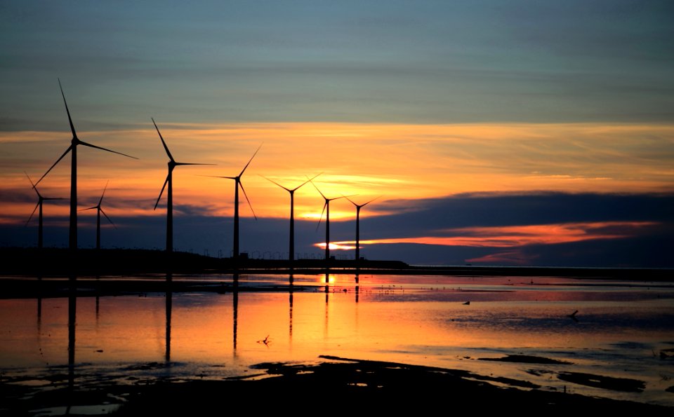 Silhouette Photo Of Wind Energys During Golden Hour