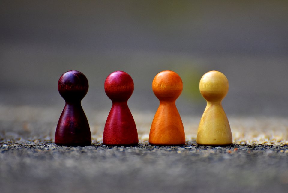 Focus Photo Of 4 Wooden Pawn Figurine