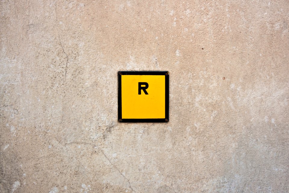R Sign In Yellow Square
