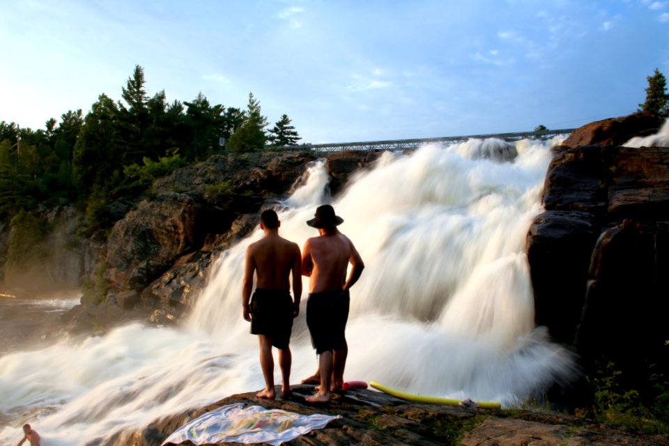 Young People Near Waterfall