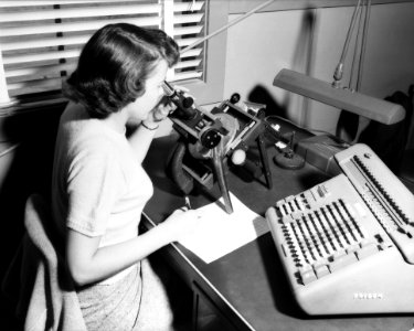Woman Computer With Microscope And Calculator photo