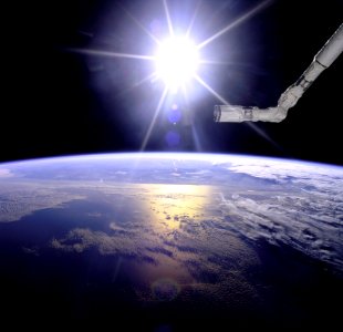 Robot Arm Over Earth With Sunburst