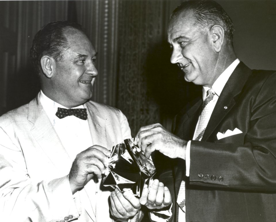 T Keith Glennan Shows LBJ Aluminized Mylar Flim Used To Make Echo I