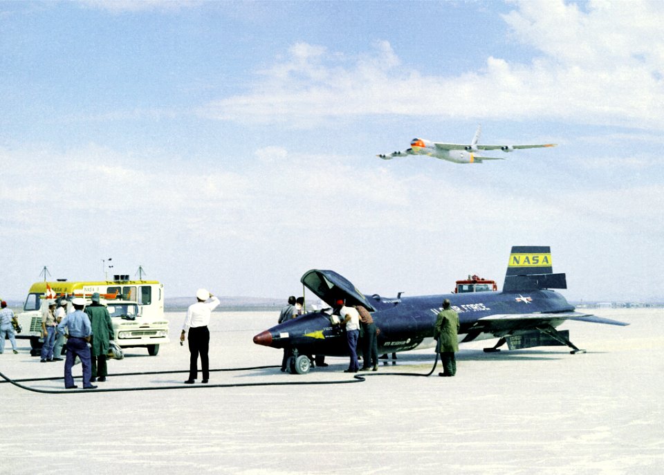X-15 On Lakebed With B-52 Mothership Flyover