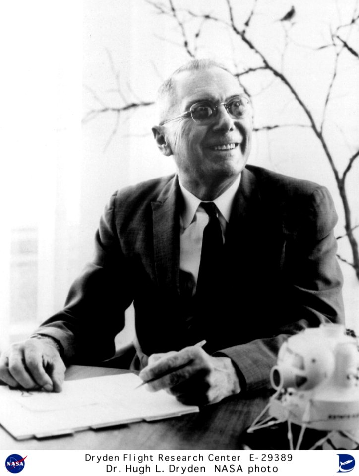 Dr Hugh L Dryden Seated At Desk