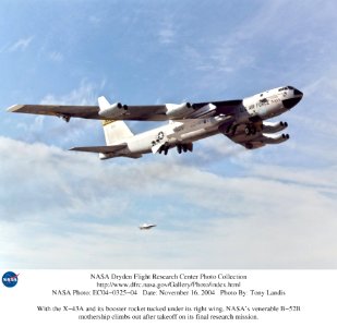 X-43A And Its Booster Rocket Tucked Under B-52B Wing