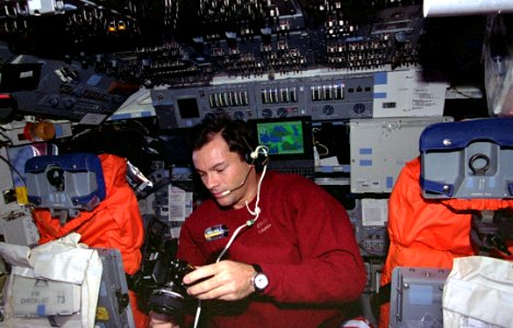 Mission Specialist Michael Lopez-Alegria Changes Out Film In Camera