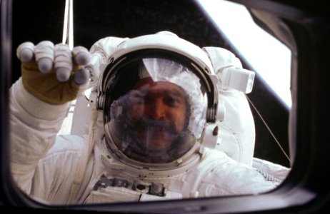 Astronaut S David Griggs Waves To Orbiter During EVA