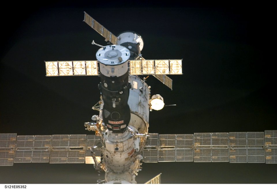 Soyuz FGB And The SM As Discovery Approaches For Docking During STS-121