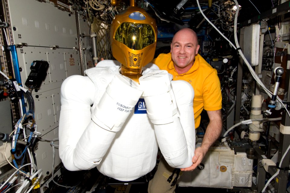 Andre Kuipers Posing With Robonaut 2