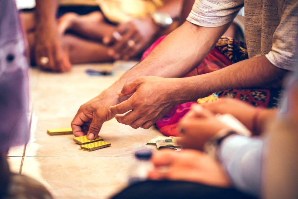 Group Of Balinese Men Playing Cards Sitting On The Floor Bali Island