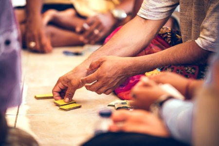 Group Of Balinese Men Playing Cards Sitting On The Floor Bali Island