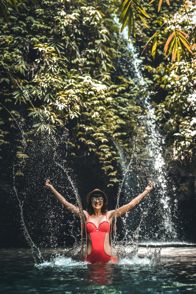 Happy Young Woman Tourist With Straw Hat In The Deep Jungle With Waterfall Real Adventure Concept Bali Island