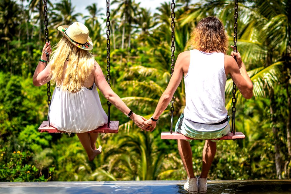 Couple Swinging In The Jungle