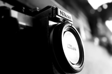 Black Nikon Bridge Camera With Closed Lens photo