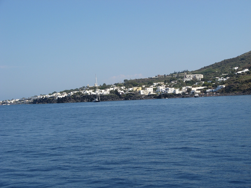 Volcano white houses sea
