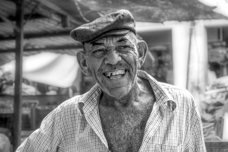 Fishmonger smiling, Maracaibo street market, Venezuela photo