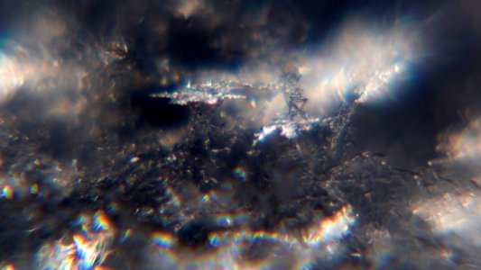 Snow crystals glittering in strong direct sunlight 42 - wide crop - high contrast
