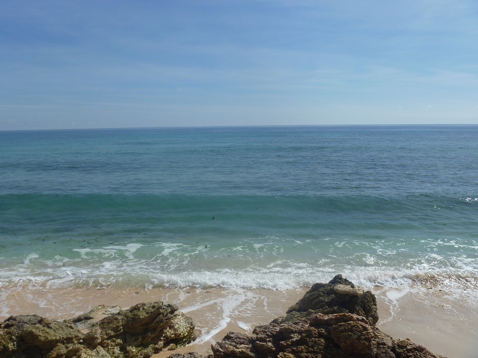 Surf rocks sky photo