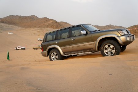 Four-wheel drive car in desert photo