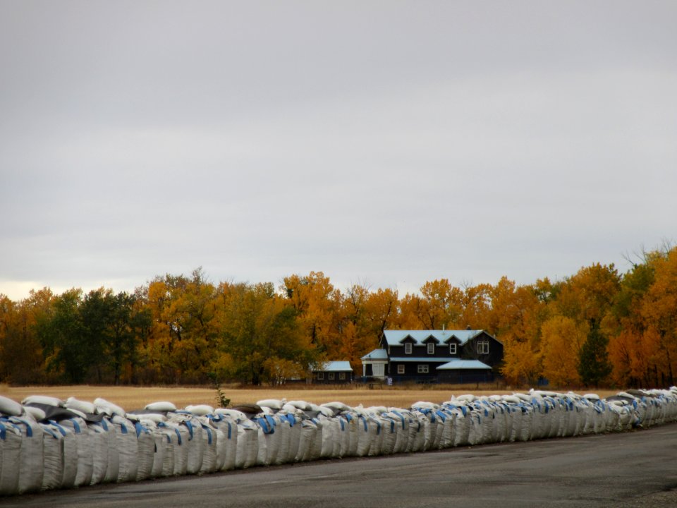 Farmhouse with Wall of Sacks