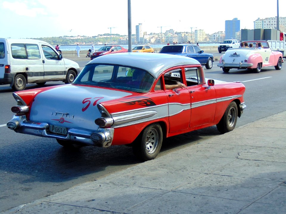 Havana. Seafront with red almendrón 2