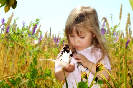 Young girl with butterfly. photo