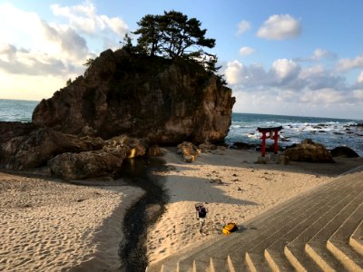 Rocks and Shrine Gate by the Seaside photo