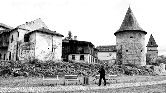 pedestrian with the rod on the shoulder